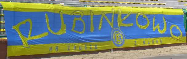 wymiary - 13x2 m flaga powstała w 2005 r. a swój debiut miała na meczu Elana - Amica II Wronki


